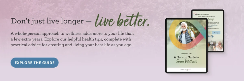 Text reads 'Don’t just live longer — live better.' Features images of a book titled 'A Holistic Guide to Senior Wellness' with a man hinking. A blue button says 'Explore the Guide.'"
