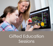 teacher working with student on building robot