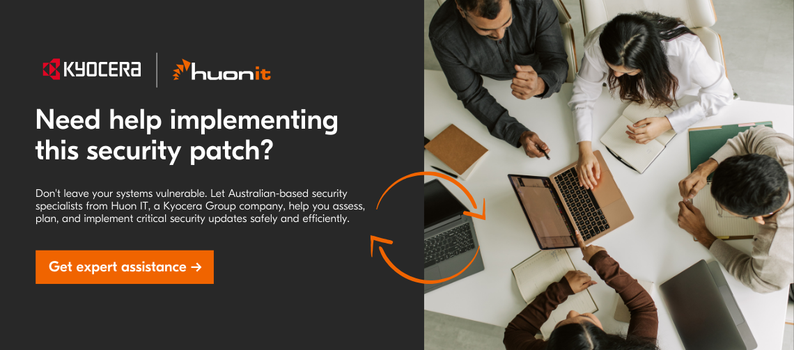 Overhead view of four professionals collaborating around a white table with laptops, notebooks, and documents, alongside Kyocera and Huon IT branding that promotes expert security patch implementation services.