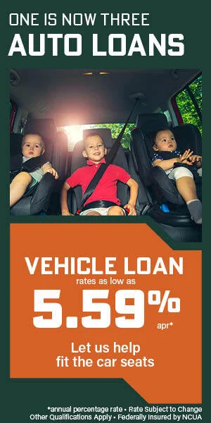 Three kids sitting in carseats in the backseat of the car