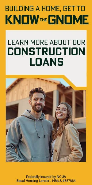 Happy Caucasian couple standing in front of house being built