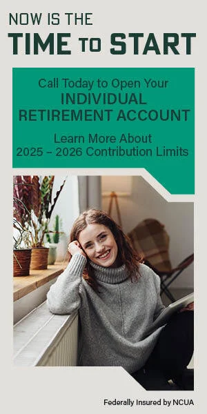 Smiling brunette woman holding tablet while sitting next to window sill full of plants