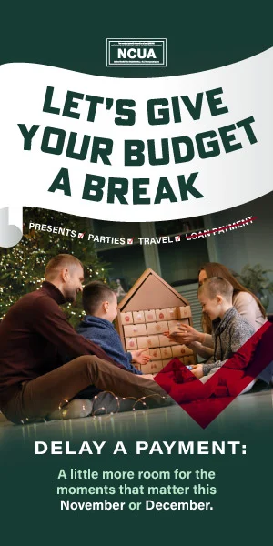 Parents looking at advent calender with two young kids