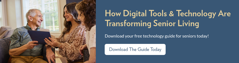 Staff member showing male resident an IPad