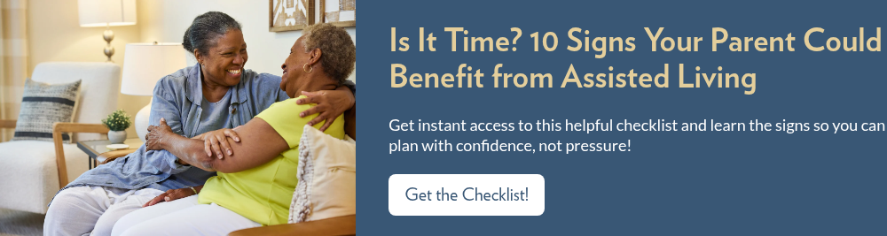 Residents hugging on a couch